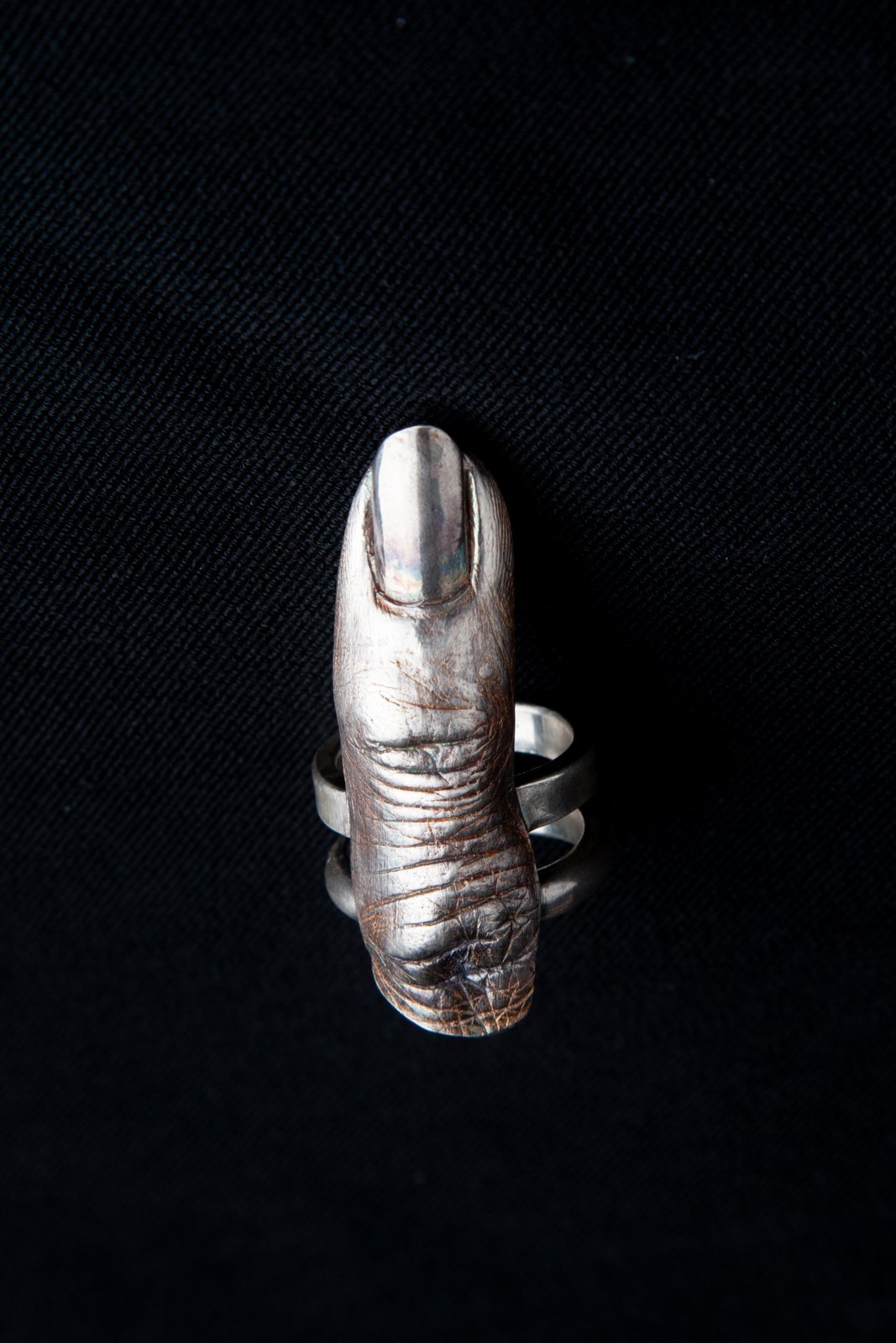 A cast of the artist's finger in sterling silver, worn as a ring